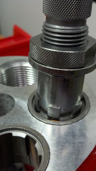 Using a die to remove a bushing